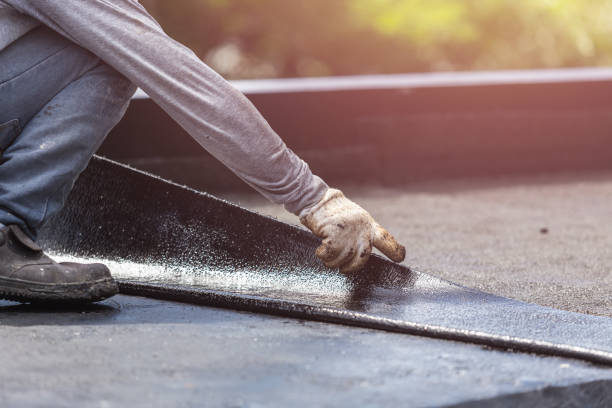 Professional Basement Waterproofing technician working in Burlington, KY